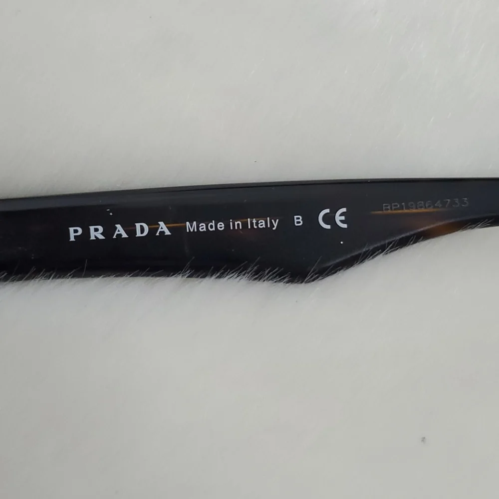 Prada used +2